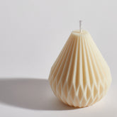 Hand-poured geometric pear drop candle showing textured wax design